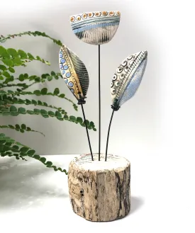 Ceramic flowers on wooden base